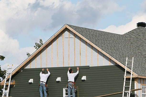 Professional Storm Damage Siding Repair technician working in Washington, IL